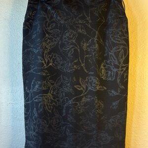 NWOT Stretchy black rose imprinted midi skirt by LuLaRoe. Size Small. Fits tigh